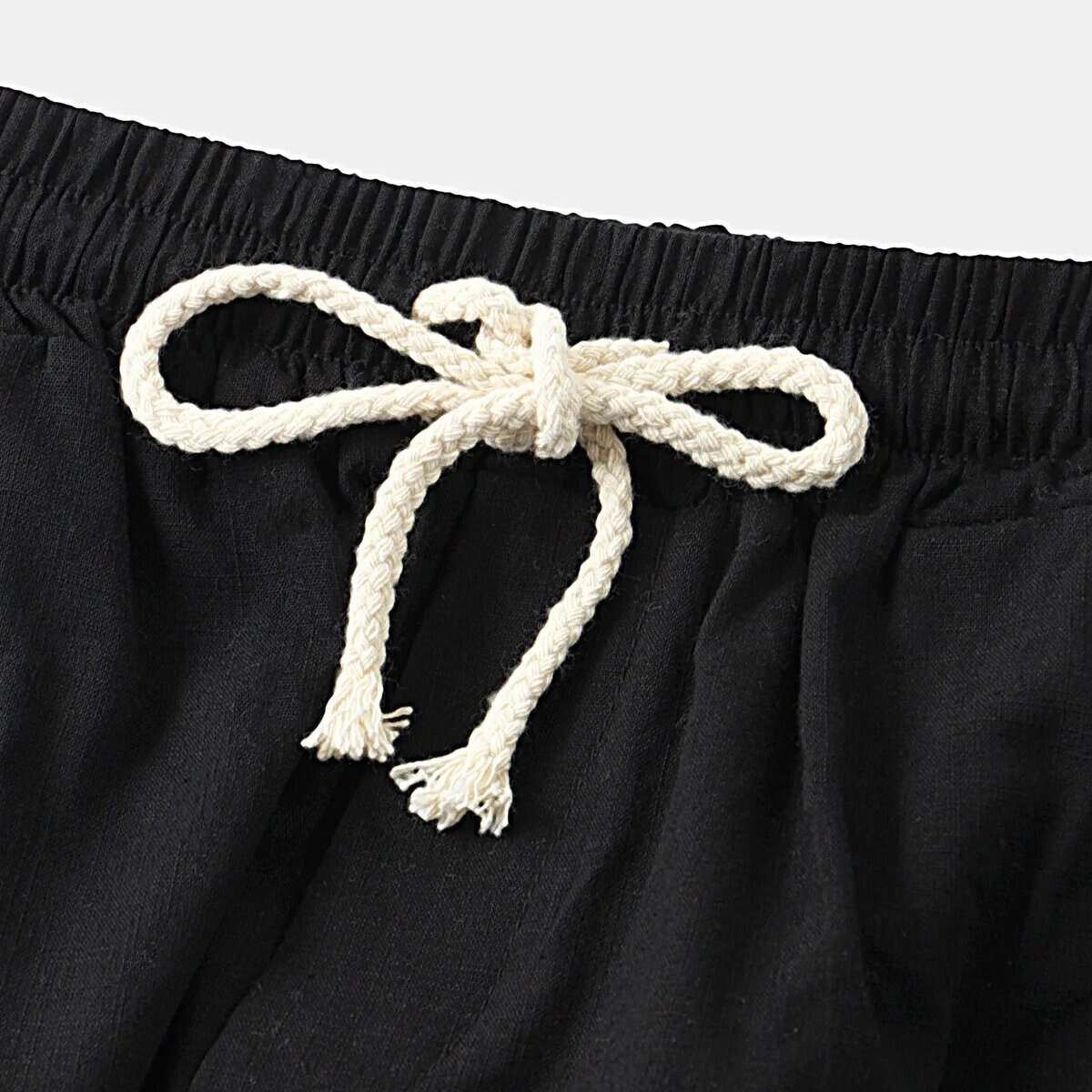 Black men's old money shorts with rope drawstring waist.