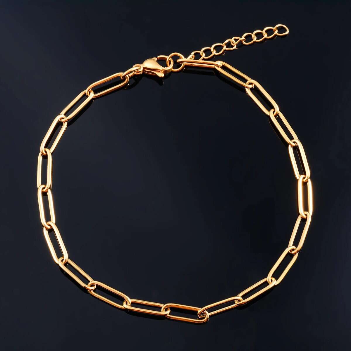 Gold paperclip chain bracelet for men, luxury old money style.